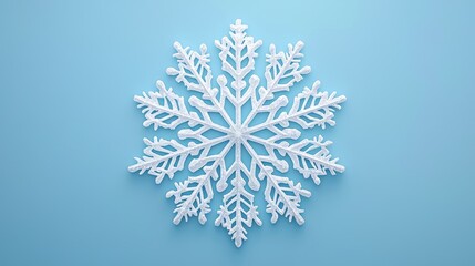 Wall Mural - Intricate white snowflake on a blue background