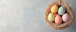 © Wonderful Studio - A colorful assortment of pastel eggs arranged in a straw nest on a soft background, perfect for spring or Easter themes.