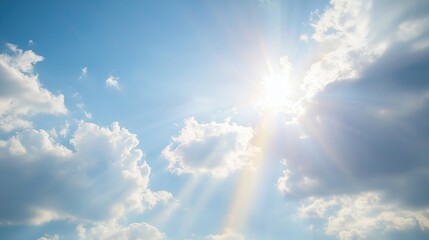 Wall Mural - A beautiful blue sky filled with fluffy white clouds and sunlight shining through.