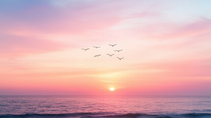 Wall Mural - A beautiful sunset over the ocean with birds flying in the sky.