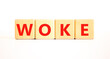 © Dzmitry - Woke question symbol. Concept word Woke question on beautiful wooden blocks. Beautiful white table white background. Business, lifestyle, support and woke question concept. Copy space.