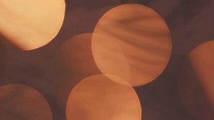 Aufkleber - blurred circular bokeh lights in warm tones background, abstract light concept