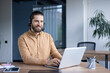 © Liubomir - Confident professional wearing a headset works diligently on a laptop in a stylish office. Perfect for concepts like customer support, remote work, and modern business solutions.