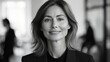 © addymawy - Professional looking woman in black and white office setting
