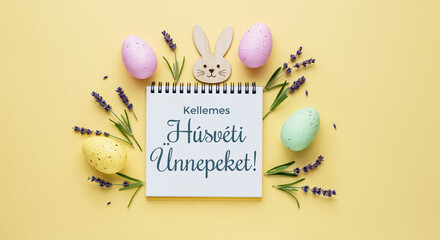 Wall Mural - easter eggs, lavender flowers and notebook saying happy easter in hungarian lying on yellow backgrou