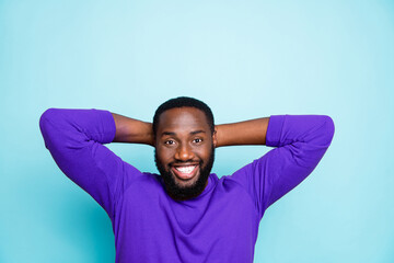 Wall Mural - Photo of amazing dark skin guy holding hands behind head have break relaxing nap refreshment moment wear casual orange pullover isolated blue color background