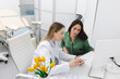 © Peakstock - Consultation of gynecologist. Doctor and woman patient is talking in gynecological office during visit at gynecology clinic