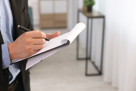 Wall Mural -  - real estate appraisal. inspector with clipboard conducting property valuation at home, closeup. spac