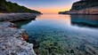 © artzone - Serene Seascape at Sunrise with Clear Azure Water and Rocky Coastline