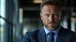 © Pixel Mind - Business executive with intense expression wearing suit in modern office environment during daytime