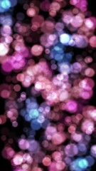 Wall Mural - Vertical Pink to Purple Bokeh Lights Shifting 4K Loop features pink, blue, and red colored defocused lights moving, twinkling, and morphing against a black background in a vertical ratio loop.