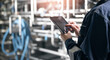 © Parilov - Concept food industry banner. Factory worker inspecting production line tanker in of dairy factory with computer tablet