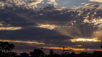 Wall Mural - silhouette of high voltage post at sunset with dramatic sky.