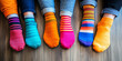 © Ekaterina Pokrovsky - Closeup of human feet in not matching colored socks. Support and awareness of people with Down syndrome. March 21.