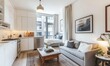 © Tanya - In this condominium, the open-plan studio apartment boasts a small white kitchen and a living room with a grey couch and a wooden coffee table.