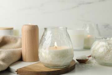 Wall Mural - Burning soy wax candles on light table