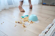 © Towfiqu Barbhuiya  - Spilled cereal creates a messy scene on the wooden floor