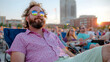© danadesa - Man enjoys outdoor concert at sunset