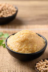 Wall Mural - Miso paste in black bowl, Japanese seasoning made from fermenting soybeans with salt, Traditional food ingredient in Japanese cuisine