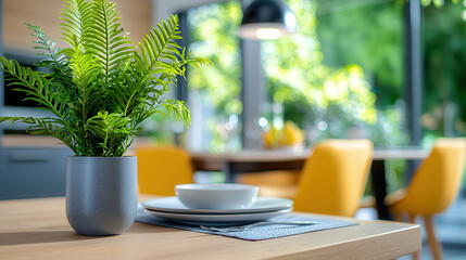 Aufkleber - modern dining space featuring potted plant, white dishware, and vibrant yellow chairs, creating fresh and inviting atmosphere
