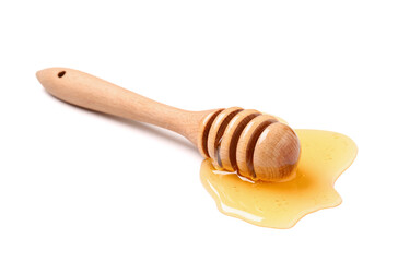 Wall Mural - Wooden dipper with spilled honey isolated on white background, closeup