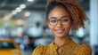 © Wiseman - confident smiling businesswoman with glasses holding laptop in modern office near white wall with blank copy space for text