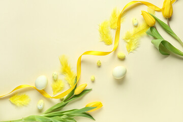 Wall Mural - Composition with Easter eggs, ribbon, feathers and tulip flowers on yellow background