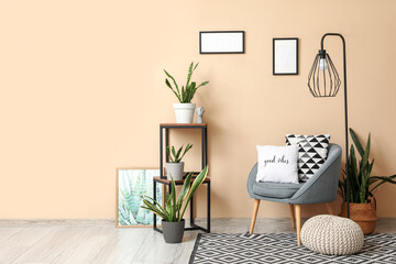 Wall Mural - Interior of living room with armchair, lamp and Sansevieria plants