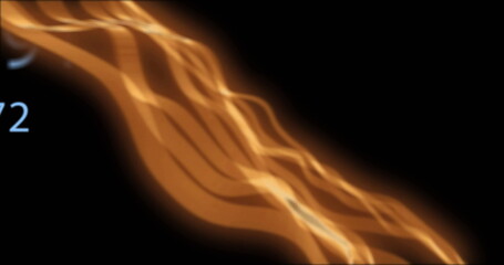 Wall Mural - image of glowing orange light trails and numbers moving on black background