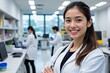 © SR Creative Idea - Confident Asian Female Doctor in Modern Lab Setting Smiling Arms Crossed