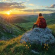 © Mongkol - Adventure trekking a backpacker on a giant rock overlooking a mountain sunset landscape