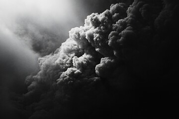 Wall Mural - dramatic black and white image of a dense smoke plume illuminated by sunlight.