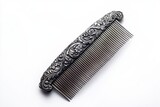 An exquisite silver hair comb featuring intricate floral carvings, resting on a pristine white backdrop highlighting vintage elegance and elaborate craftsmanship beautifully.
