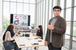 © PhugunStock - Asian male businessman standing with thumbs up looking at camera, businessman brainstorming, discussing analysis, innovation, collaboration. online business Sales techniques and strategic planning
