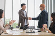 © PhugunStock - Happy Asian business men holding hands, brainstorming, talking about analysis, innovation and collaboration. Online business, sales techniques, strategic planning