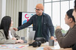 © PhugunStock - Asian male businessman sends encouragement to friend Join the meeting happily, brainstorm and talk about analysis, innovation, and collaboration. online business Sales techniques strategic planning