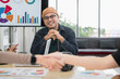 © PhugunStock - Asian male businessman Looking at friends holding hands After consulting, brainstorm and talk about analysis, innovation, collaboration. Online business, sales techniques, modern strategic planning