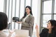© PhugunStock - An Asian businesswoman happily explains VR glasses to fellow attendees, brainstorming and discussing analysis, innovation, collaboration. online business Sales techniques and strategic planning