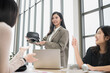 © PhugunStock - An Asian businesswoman happily explains VR glasses to fellow attendees, brainstorming and discussing analysis, innovation, collaboration. online business Sales techniques and strategic planning