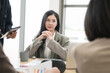 © PhugunStock - Asian businesswomen sit in a tense meeting and brainstorm, discussing analysis, innovation, collaboration. online business Modern sales techniques and strategic planning