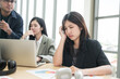 © PhugunStock - Asian businesswomen sit in a tense meeting and brainstorm, discussing analysis, innovation, collaboration. online business Modern sales techniques and strategic planning