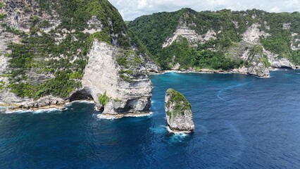 Wall Mural - Aerial view of Nusa Penida's rocky cliffs and azure sea.