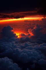 Wall Mural - fiery sunset over clouds, sky bursts with orange and red colors. use for travel
