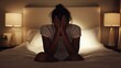 © ColleAno - Withdrawal symptoms in a person with their hands over their face, sitting on a bed. Featuring emotional distress and physical exhaustion
