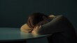 © ColleAno - Withdrawal symptoms in a person with their head resting on a table. Featuring emotional exhaustion and physical discomfort