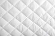 © Shelley - White quilted fabric background texture