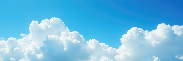 Wall Mural - Clouds drifting across a brilliant blue sky with a few wispy strands, lazily, puffy, airy