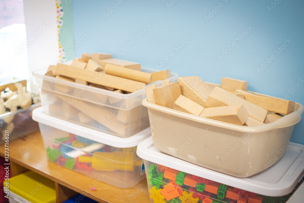 Organized Building Blocks Close-up wooden building blocks, plastic connecting gear shapes, animal ...