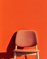 Aufkleber - Mid-Century Modern Chair with Plush Orange Upholstery Against Bold Background - Contemporary Design Inspiration for Urban Offices and Vibrant Interior Styling Solutions