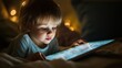 © Ummeya - Toddler Child Using Tablet in Bed at Night Screen Light Adorable